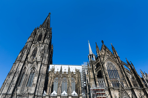 Cologne Cathedral low angle view from the side with blue sky