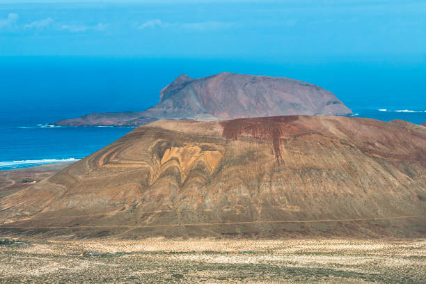 View from the Mirador del Rio in Lanzarote, Spain to the Isla La Graciosa with the volcano Montana Pedro Barba.