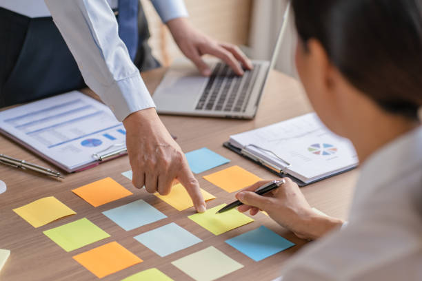 istock Business People brainstorming Meeting Design Ideas use post it notes to share idea professional investor start up project business brainstorming planning in office 1497618653