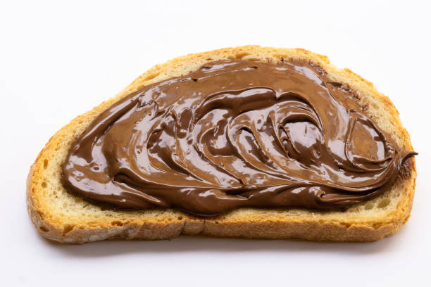 istock Slice of bread with chocolate cream isolated on white 1497621619