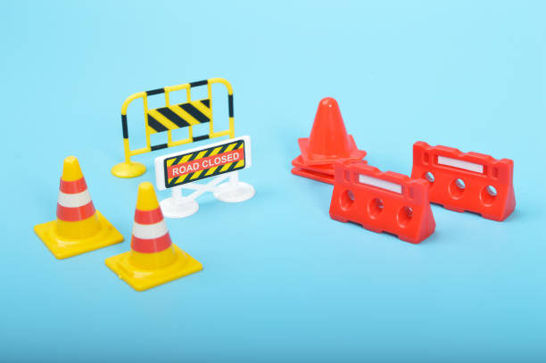 istock Traffic road repair barriers set with text under construction. Safety barricade, roadblocks, warning alert signs. Construction fences, traffic cones and repair hurdles, safety barricade warning 1497622015