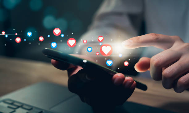istock Hand holding smartphone and shows a digital screen of social media notifications. 1497622476