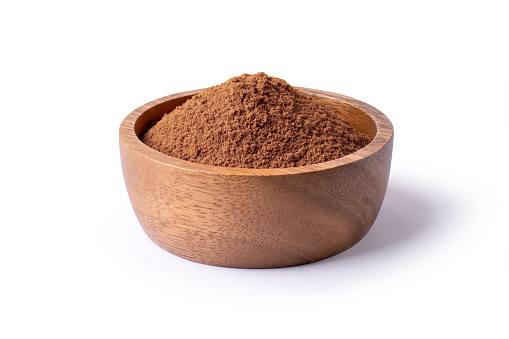 Chocolate powder in wooden bowl  isolated on white background with clipping path.