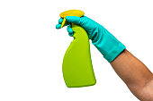 Woman's hand wearing washing glove holding spray bottle