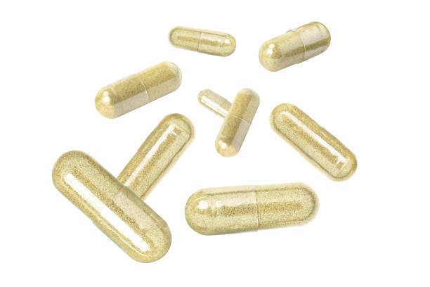 Maca powder herbal medicine capsule flying in the air isolated on white background.