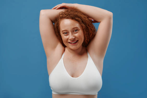 istock Redhead girl with freckles on a blue background 1497628528