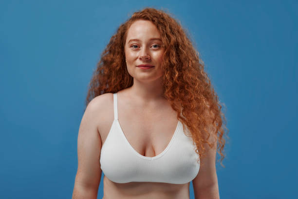 istock Redhead girl with freckles on a blue background 1497628531