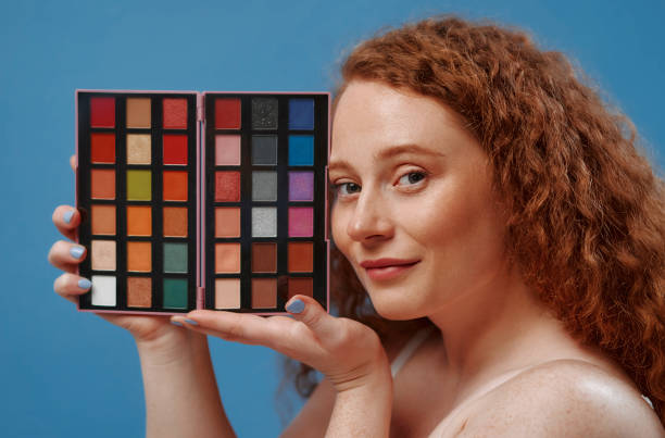 istock Redhead girl with freckles on a blue background 1497628533