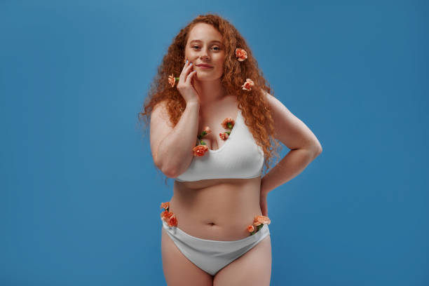 istock Redhead girl with freckles on a blue background 1497628565