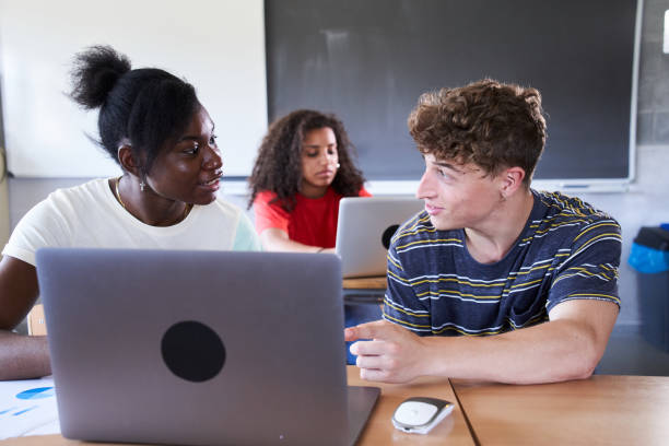 istock Group of students using computer laptop preparing for exam in university. Education concept. 1497629637
