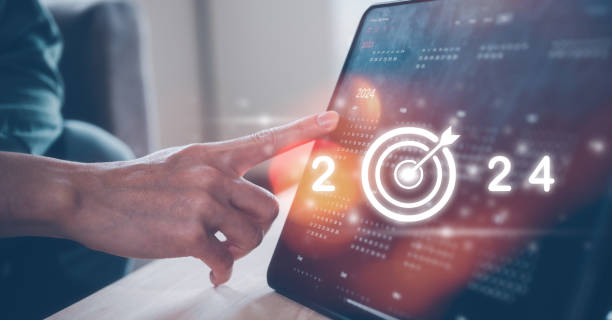 istock Concept of time management financial planning and reminder for 2024. man using computer tablet working with calendar 2024, business planning marketing and investment, schedule appointment meeting 1497641538