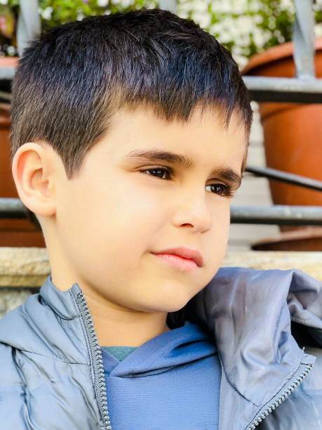 istock Young caucasian boy outdoors portrait 1497643714