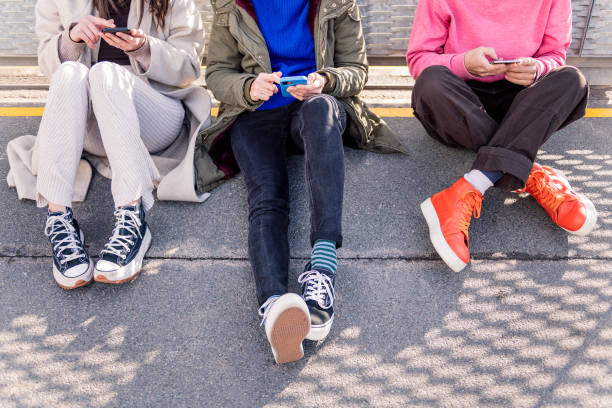 friends scrolling through social media with phone