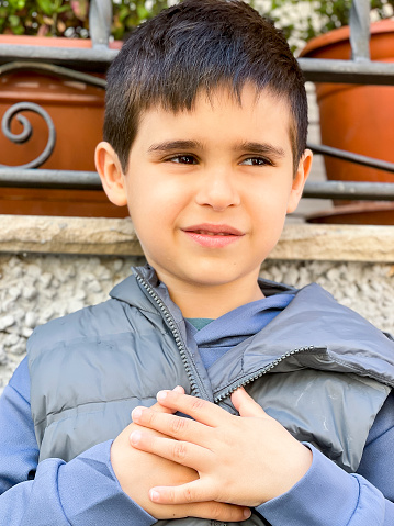 Outdoors portrait of a young Caucasian boy