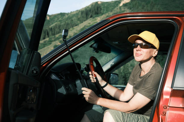 istock Mature vlogger is telling about her road trip in mountains 1497646004