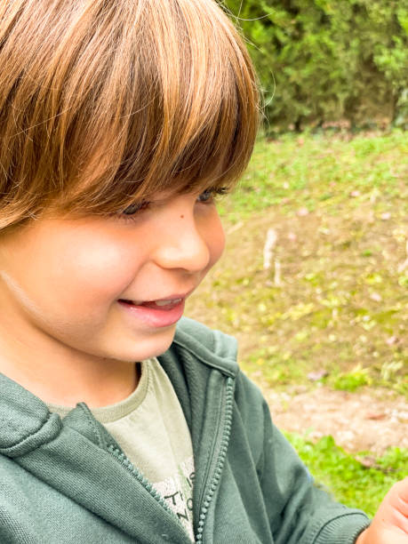 istock Outdoors portrait of a smiling young boy 1497646016