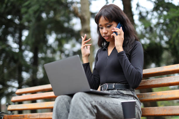 The women is talking on the phone and working on a laptop on a park bench.
The mulatto women is talking on the phone and working on a laptop on a park bench. The women is talking on the phone and working on a laptop on a park bench. beautiful mulatto women stock pictures, royalty-free photos & images