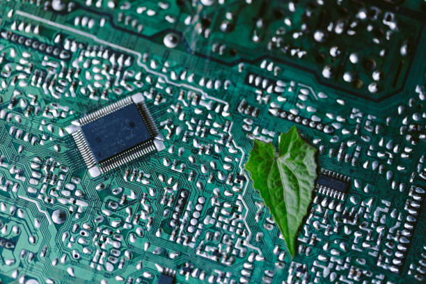 istock Leaf on the converging point of computer circuit board. Green computing, Green technology, Green IT, CSR, and IT ethics. Concept of green technology. Environment green technology. 1497654520
