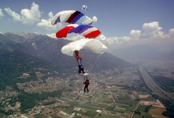 istock Skydive athletes perform above Swiss mountain landscape 1497655745