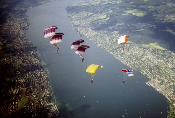 istock Skydive athletes perform above Swiss mountain landscape 1497655794