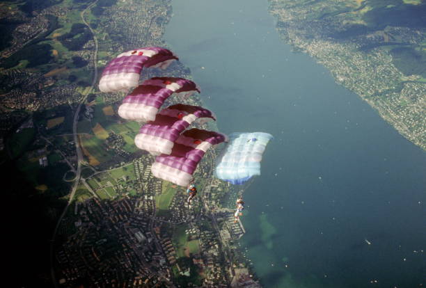 istock Skydive athletes perform above Swiss mountain landscape 1497655795
