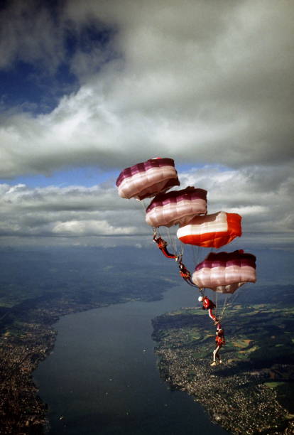 istock Skydive athletes perform above Swiss mountain landscape 1497655796