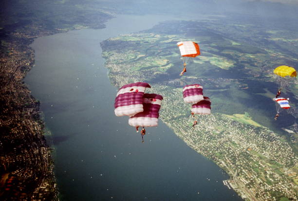 istock Skydive athletes perform above Swiss mountain landscape 1497655801