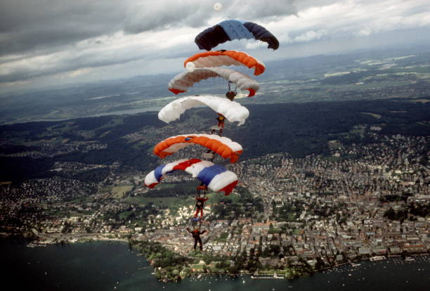 istock Skydive athletes perform above Swiss mountain landscape 1497655838