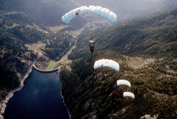 istock Skydive athletes perform above Swiss mountain landscape 1497655839