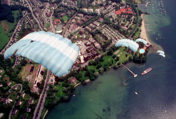 istock Skydive athletes perform above Swiss mountain landscape 1497655937