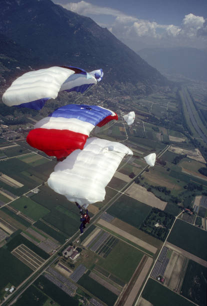 istock Skydive athletes perform above Swiss mountain landscape 1497656027