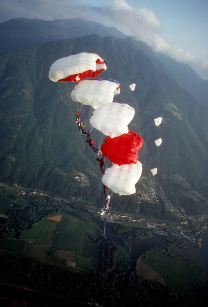 istock Skydive athletes perform above Swiss mountain landscape 1497656028
