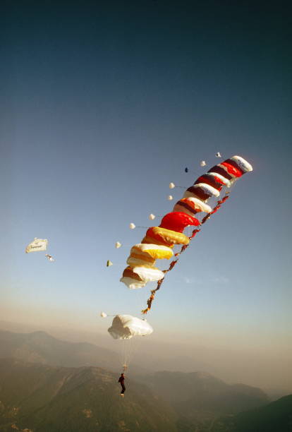 istock Skydive athletes perform above Swiss mountain landscape 1497656030