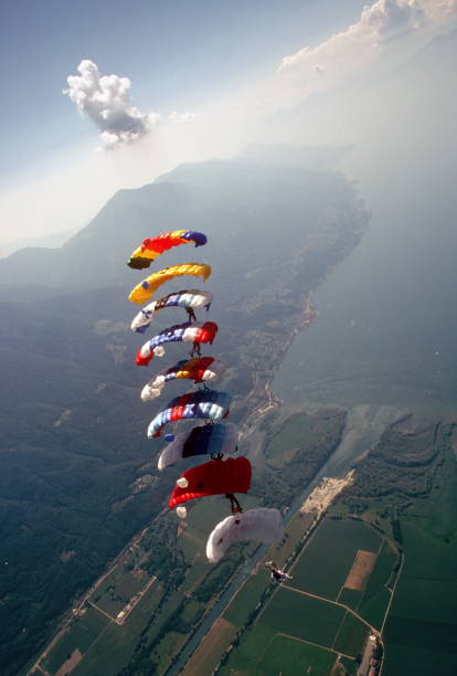 istock Skydive athletes perform above Swiss mountain landscape 1497656139