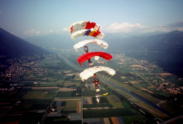 istock Skydive athletes perform above Swiss mountain landscape 1497656152
