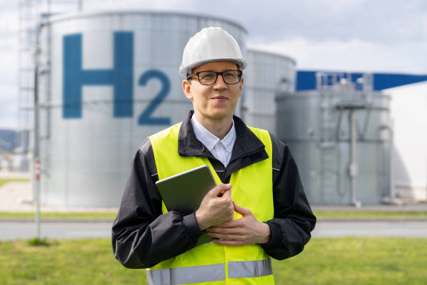 istock Engineer on a background of Hydrogen factory 1497658827
