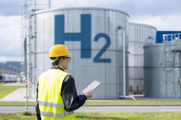 istock Engineer on a background of Hydrogen factory 1497659103