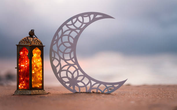 istock Crescent moon with lantern lamp in the beach 1497659109