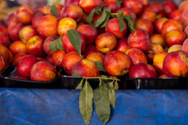 peaches for sale at grocery store in summer
