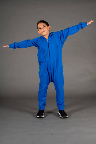 istock kids emotional portrait boy is in blue rompers studio shoot still 1497662688