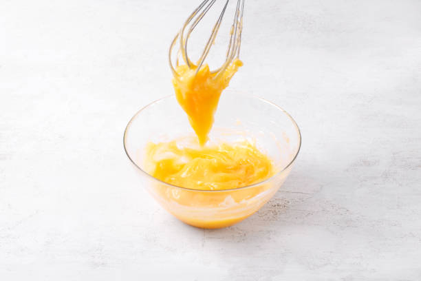 istock Mixing citrus curd with a whisk in the glass bowl 1497662814