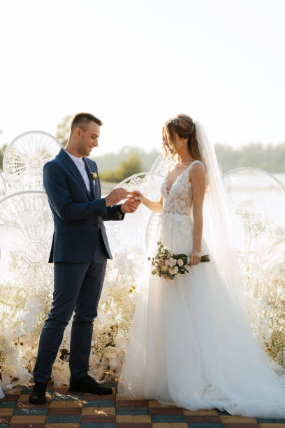 istock wedding ceremony of the newlyweds on the pier 1497664708