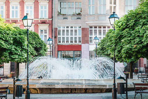 A city fountain in the center of a small town. The center of Walbrzych