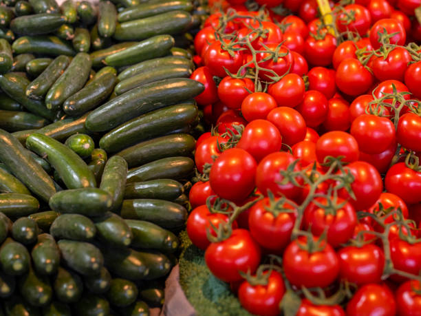 fresh tomatoes and cucumbers at the local market