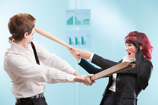 Humorous relationship between coworkers, play-acting as competitors with weapons.