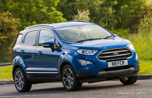 Stony Stratford,UK - June 4th 2023: 2020 blue FORD ECOSPORT car travelling on an English country road.