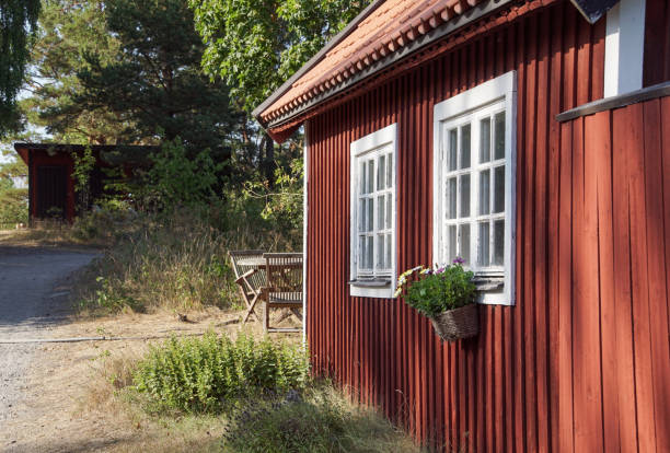 istock a red cabin out in the countryside during the summer 1497672084