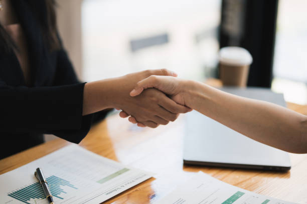 istock Recruiter shaking hands with a young female candidate after a job interview. 1497673856