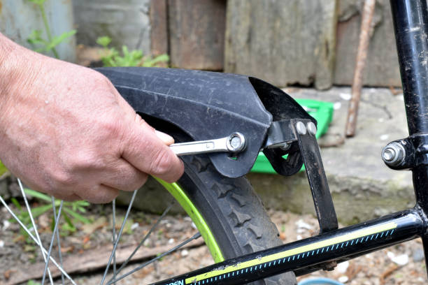 istock A mechanic tightens a bicycle fender bolt. 1497679062