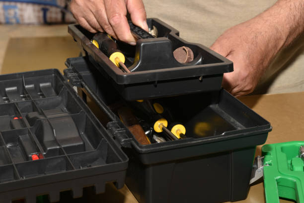 istock A man removes the top cover from a toolbox. 1497679452